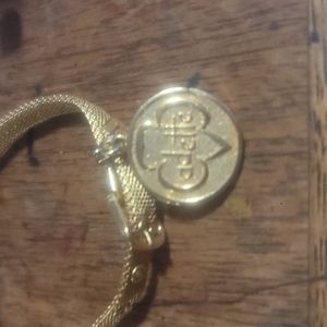 18kt gold plated belt buckle bracelet with 18kt gold plated charm
